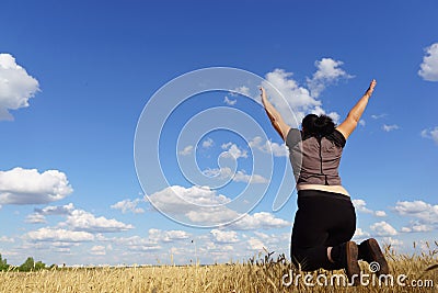 Overweight woman jumping at sky background Stock Photo