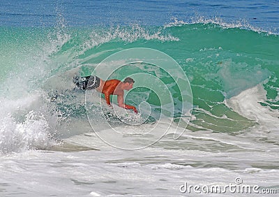 Bodyboarder riding a gnarly wave at Laguna Beach, CA Editorial Stock Photo