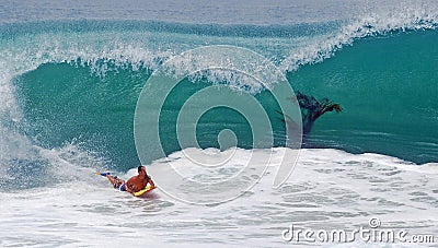 Bodyboarder riding a hugh wave at Laguna Beach, CA Editorial Stock Photo