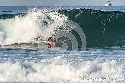 Bodyboarder riding a wave Editorial Stock Photo