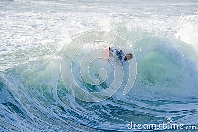 Bodyboarder surfing ocean wave Stock Photo