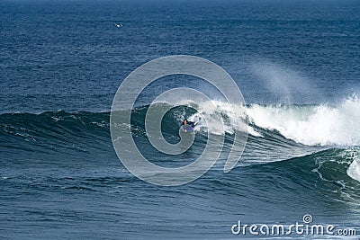 Bodyboarder surfing ocean wave Stock Photo