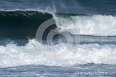 Bodyboarder surfing ocean wave Stock Photo