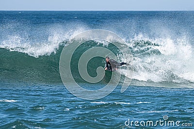 Bodyboarder surfing ocean wave Stock Photo