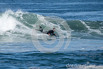 Bodyboarder surfing ocean wave Stock Photo