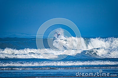 Bodyboarder surfing ocean wave Stock Photo