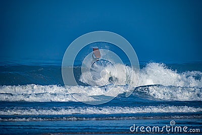 Bodyboarder surfing ocean wave Stock Photo