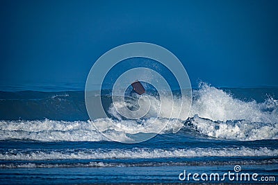 Bodyboarder surfing ocean wave Stock Photo