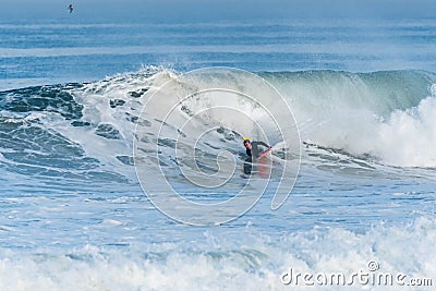Bodyboarder surfing ocean wave Stock Photo