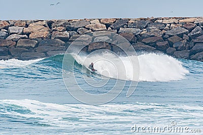 Bodyboarder surfing ocean wave Stock Photo