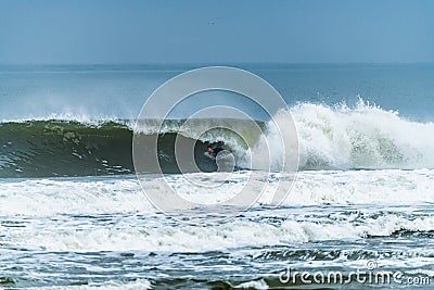 Bodyboarder surfing ocean wave Stock Photo