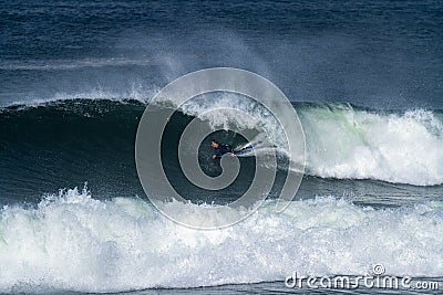 Bodyboarder surfing ocean wave Stock Photo