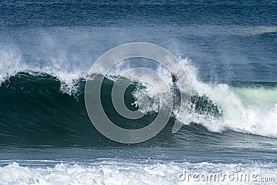 Bodyboarder surfing ocean wave Stock Photo