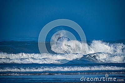 Bodyboarder surfing ocean wave Stock Photo