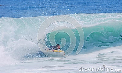 Bodyboarder in a wave at Laguna Beach, CA. Editorial Stock Photo