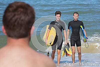 Bodyboarders on the shore Stock Photo