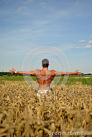 Bodybuilder with arms wide open Stock Photo