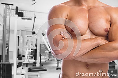 Bodybuilder bodybuilding flexing chest muscles posing fitness gym body builder building strong muscular man Stock Photo