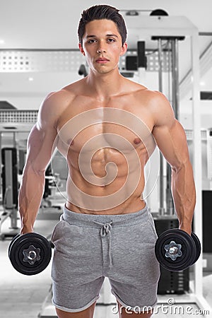 Bodybuilder bodybuilding muscles gym strong muscular young man d Stock Photo