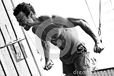 Bodybuilder hard training in the gym Stock Photo