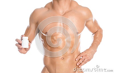Bodybuilding and chemical additives: handsome strong bodybuilder holding a white jar of pills on white isolated background in stud Stock Photo