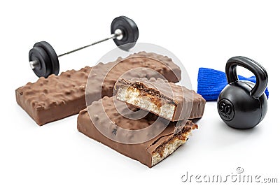 Bodybuilding and weight training, sports nutrition and muscle grow concept with energy protein bars, bellbar and kettlebell Stock Photo