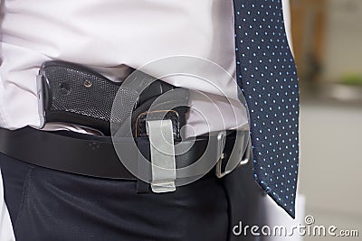 Bodyguard with gun Stock Photo