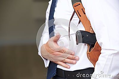 Bodyguard with gun Stock Photo