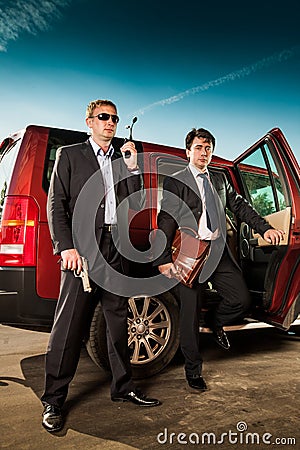 Bodyguard and its boss Stock Photo