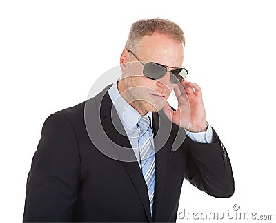 Bodyguard wearing sunglasses Stock Photo