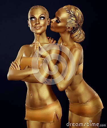 Bodypaint. Two Women Painted Gold. Carnival Stock Photo