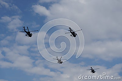 Boeing AH-64 attack helicopters on formation during an air show. Greek Air Force Apache flying on Thessaloniki, Greece during the Editorial Stock Photo