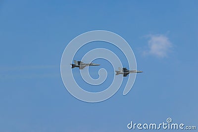 Boeing EA-18G fighter jets doing fly-bys at EAA AirVenture against a blue sky Editorial Stock Photo