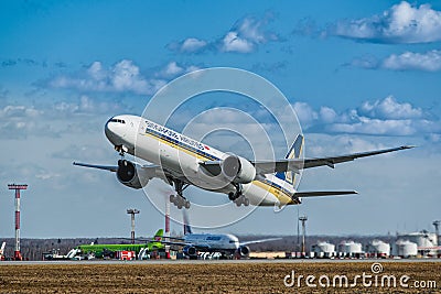Boeing 777-300 ER Singapore Airlines off the runway at the airport Editorial Stock Photo