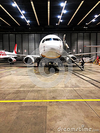 Airplane in the hangar for maintance Editorial Stock Photo