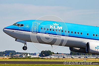 Boeing 737 pasenger plane from KLM Royal Dutch Airlines taking off from Amsterdam-Schiphol Airport. Amsterdam, The Netherlands - Editorial Stock Photo