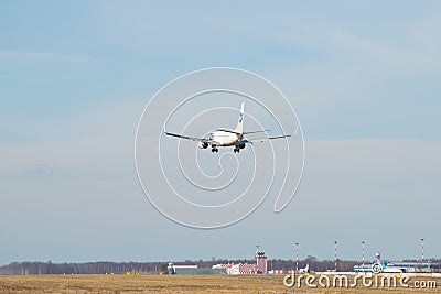 The Boeing 737-80 `Roman Marchenko` VQ-BJJ of UTair airline makes landing on the Pulkovo airport Editorial Stock Photo