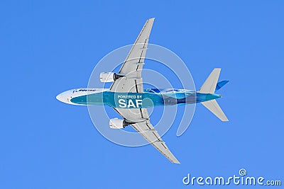 Boeing 777 underside with powered by SAF Sustainable Aviation Fuel text Editorial Stock Photo
