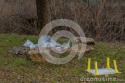 Trash discarded under tree Editorial Stock Photo