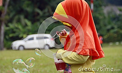 Blowing the soap bubble Editorial Stock Photo
