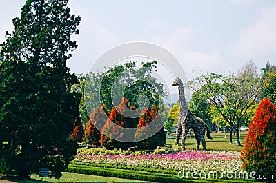 Bogor, Indonesia - A view of the flower themed park Taman Bunga Nusantara in a cloudy afternoon with a view to a bush shaped as a Stock Photo