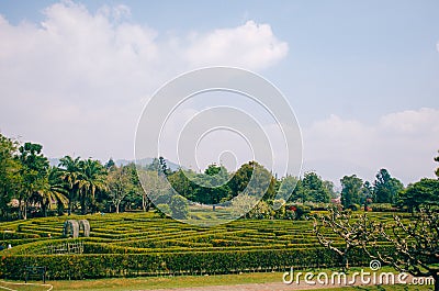Bogor, Indonesia - A view of the flower themed park Taman Bunga Nusantara in a cloudy afternoon with a view to a labyrinth field Editorial Stock Photo