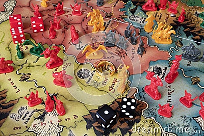 Close up to a Lord of the rings risk game board with game pieces and dice Editorial Stock Photo