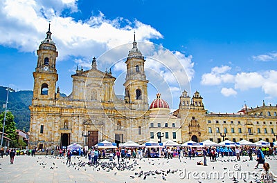 BOGOTA, COLOMBIA OCTOBER 22, 2017: Unidentified people walking in Bolivar square church in a beautiful blue sky in Editorial Stock Photo