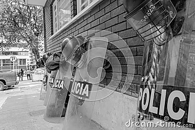 BOGOTA, COLOMBIA - Police Riot helmets and shields over a brick Editorial Stock Photo