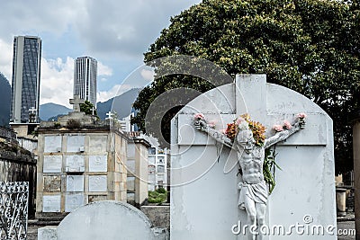 JesusChrist Stone adorned with multicolor flowers like a crown into Central Cemetery. Editorial Stock Photo