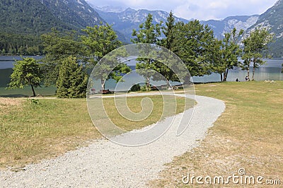 Bohinj, Slovenia - June 4, 2017: Tourists on a small boat in lake Bohinj, a famous destination not far from lake Bled. Editorial Stock Photo