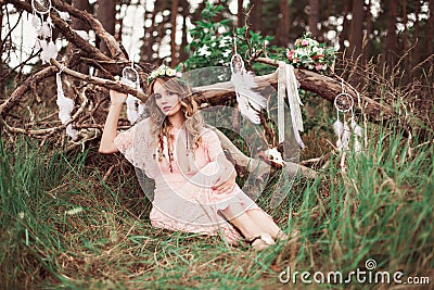 Boho Bride With Dream Catchers In Forest Stock Photo