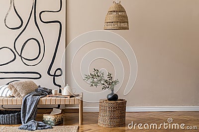 Earth tones home decor of living room interior with wooden furnitures and boho natural decorations. Stock Photo