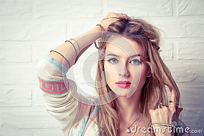 Boho Girl Portrait at White Brick Wall Background Stock Photo